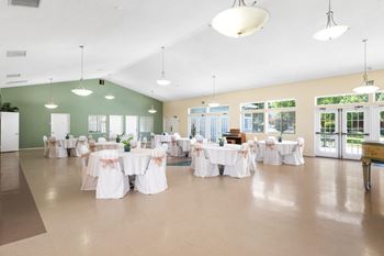A room with tables set up for a function.